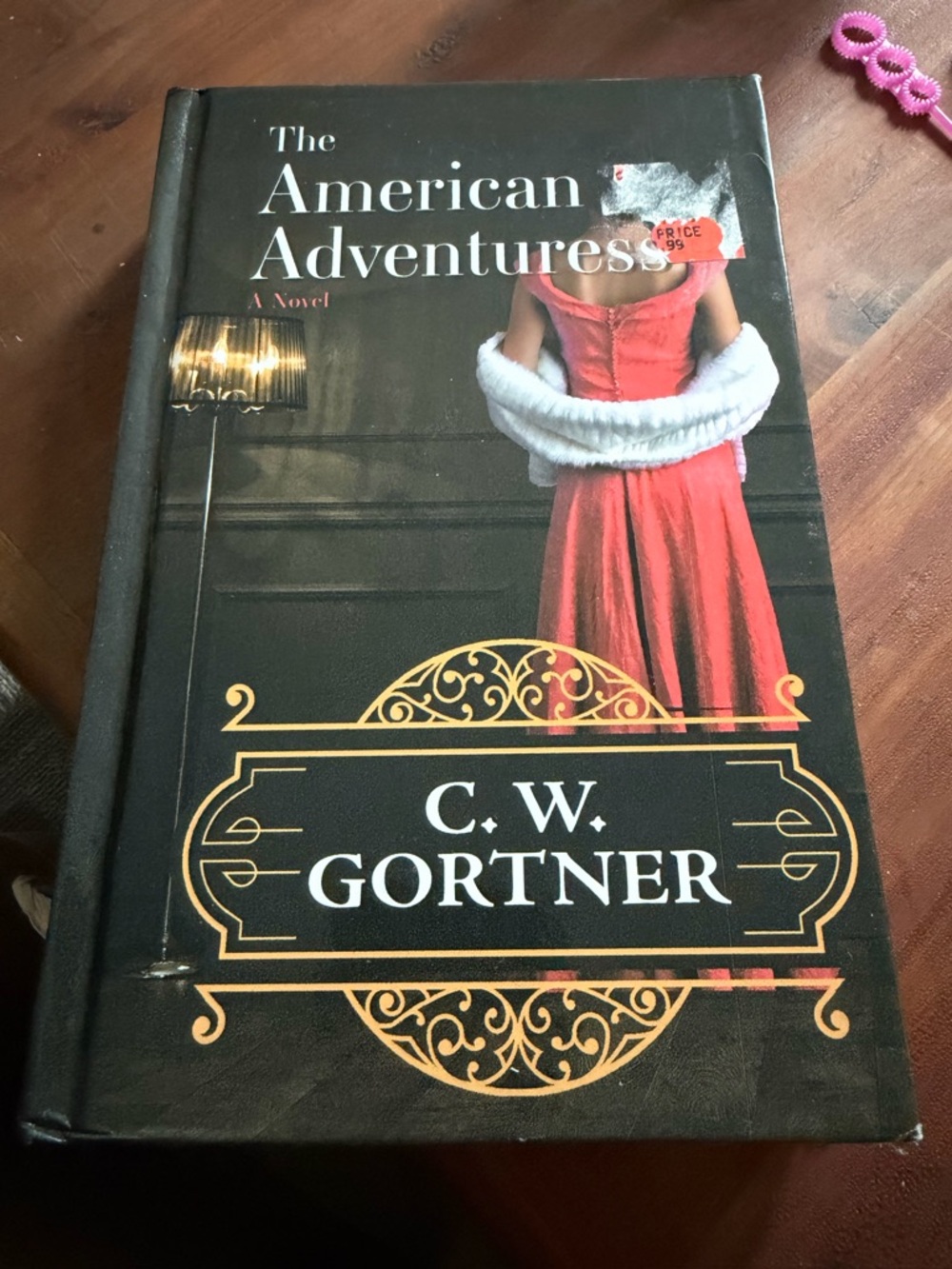 The American Adventuress by — Red and Black Hardcover